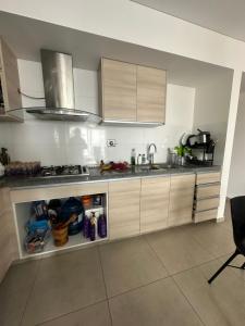 a kitchen with a sink and a counter top at Cuarto privado in Santa Cruz de la Sierra