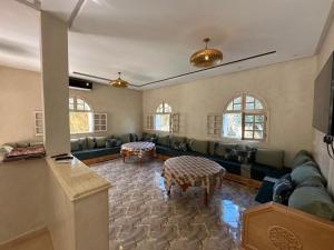 a large living room with a couch and a table at Villa Ourika ,Roche Rouge in Ourika