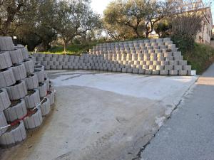 a stack of concrete blocks sitting on the side of a road at Studio Primani in Sečovlje