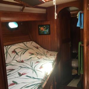 a bed in the back of a boat at St Thomas stay on Sailboat Ragamuffin incl meals water toys in Water Island