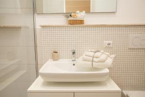a bathroom with a white sink and a shower at Antica Piazzetta in Canneto