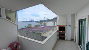 a view of a balcony with a large window at Quinta da Casinha Homestay in Pombal