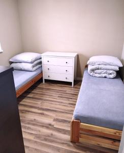 Postel nebo postele na pokoji v ubytování Noclegi Tuszyn L