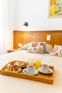 Postel nebo postele na pokoji v ubytování Hotel España