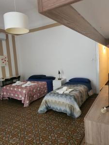 A bed or beds in a room at San Berillo house