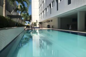 a swimming pool in the middle of a building at Paraíso beira-mar em Tambaú! Nobile Suites #508 in João Pessoa