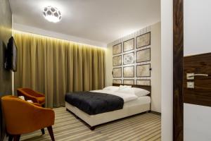Posteľ alebo postele v izbe v ubytovaní Hotel Pory Roku