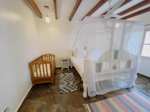 Postel nebo postele na pokoji v ubytování Afro-boho Villa with Private Pool