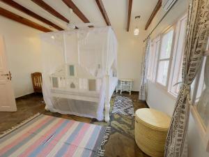 Postel nebo postele na pokoji v ubytování Afro-boho Villa with Private Pool