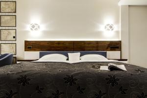 Posteľ alebo postele v izbe v ubytovaní Hotel Pory Roku