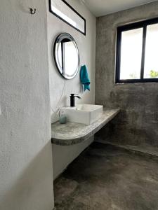 a bathroom with a sink and a mirror at Very quiet in Isla Mujeres +15 photos