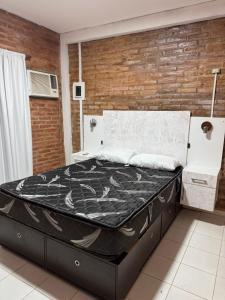 En eller flere senge i et værelse på Casa en Paso de la Patria