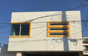 a building with two windows on the side of it at Departamento "A" Fracc Cd Del Valle in Tepic