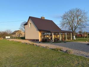 a large house with a large group of windows at Apartament Willa Dom wakacyjny Agroturystyka Zacisze11 Idealny dla rodzin z dziećmi Holiday Home Vacation House",Cały dom na wyłączność in Węgorzyn