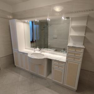 a bathroom with a sink and a large mirror at Casa Dany in Tremosine Sul Garda +15 photos