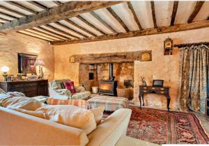 a living room with a couch and a fireplace at Beautiful Brecon Beacon House in Llandovery
