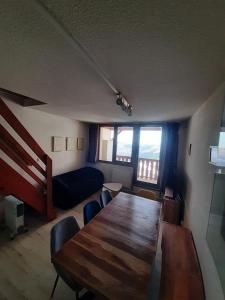 Posezení v ubytování La Mongie T3 duplex 8 personnes, 2 chambres, 2 alcoves + 10 fotografií
