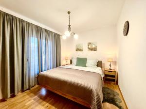 a bedroom with a bed and a large window at Apartments Terra Solaris in Medulin +37 photos