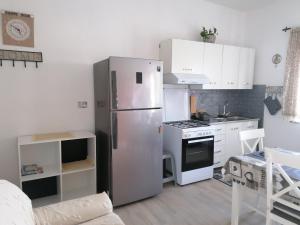 Η κουζίνα ή μικρή κουζίνα στο La casetta di Tzia Caicca +30 φωτογραφίες