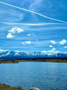 a view of a lake with mountains in the background at Eternum Glamping in Žabljak