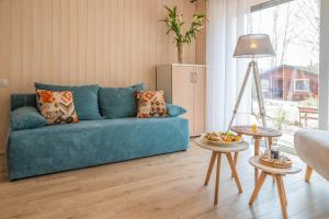 Posezení v ubytování Apartament nad jeziorem Strykowskim