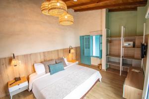 Ένα ή περισσότερα κρεβάτια σε δωμάτιο στο Hotel Salento Real Eje Cafetero