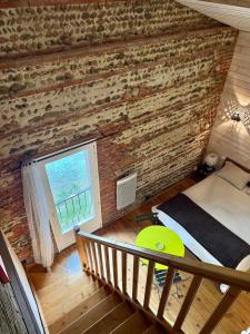 Postel nebo postele na pokoji v ubytování Le Duplex de l'Artisterie