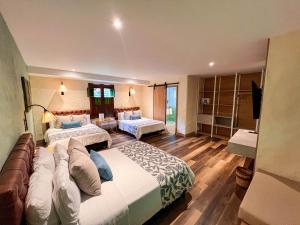 Ένα ή περισσότερα κρεβάτια σε δωμάτιο στο Hotel Salento Real Eje Cafetero
