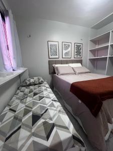 a bedroom with a bed and aocoustic at Marino Beach in Aquiraz +14 photos