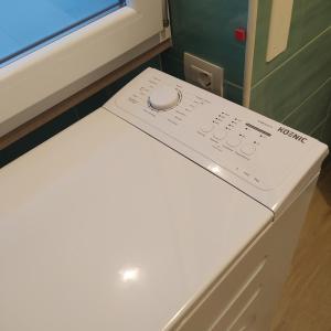a remote control sitting on top of a white refrigerator at Casa Dolce Casa in Trecase +45 photos