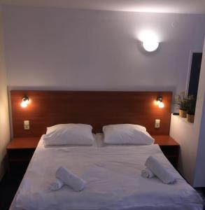 Voodi või voodid majutusasutuse Hotel ELMA toas