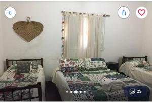 Postel nebo postele na pokoji v ubytování Hosteria Calamuchita