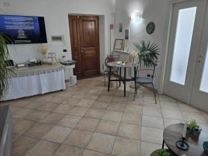 TV a/nebo společenská místnost v ubytování Itaca B&B