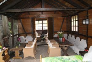 a room with tables and chairs in a building at Ferienwohnungen TalBach in Simmerath +95 photos