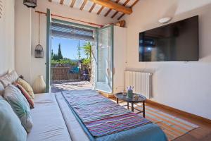 Μια τηλεόραση ή/και κέντρο ψυχαγωγίας στο Encantadora casa en Peratallada