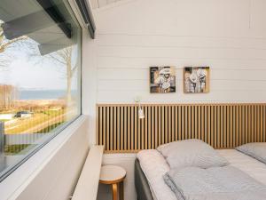 a small room with a bed and a window at 6 person holiday home in Aabenraa-By Traum in Aabenraa +40 photos