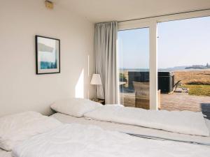 Ένα ή περισσότερα κρεβάτια σε δωμάτιο στο Luxury Seaside Retreat - By Traum Ferienwohnungen +58 φωτογραφίες