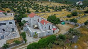 an aerial view of a house in a field at Stoneview IΙ in Areopoli
