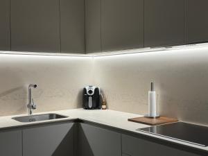 a kitchen with a sink and a counter top at San Fermín centro in Pamplona