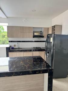 Kuchyň nebo kuchyňský kout v ubytování Hermoso apartamento en alquiler con jacuzzi