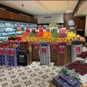 a produce section of a grocery store with fruits and vegetables at Beach Holiday Home-Close to Airport-3 Bed & 2 Bath in Lauderdale