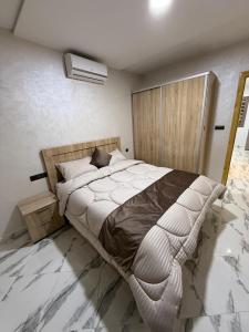 Postel nebo postele na pokoji v ubytování Appartement internationale