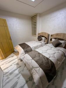 Postel nebo postele na pokoji v ubytování Appartement internationale