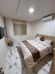 Postel nebo postele na pokoji v ubytování Appartement internationale