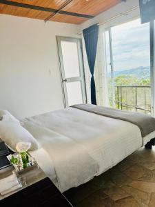 Postel nebo postele na pokoji v ubytování Ecohotel Portillo de San Bernardo
