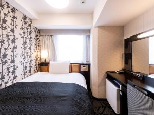 Postel nebo postele na pokoji v ubytování APA Hotel Suidobashi Ekimae + 37 fotografií