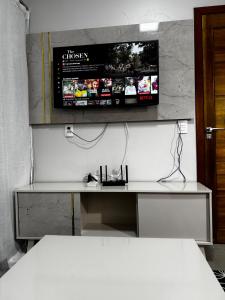 TV a/nebo společenská místnost v ubytování Casa elegante, próximo às cataratas + 37 fotografií