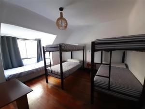 Postel nebo postele na pokoji v ubytování Atacama Hostel Backpackers