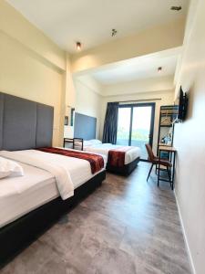 Pangkor Pop Ash Hotel客房内的一张或多张床位