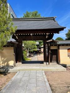 an entrance to a shrine with a building at ジャンハウス in Takayama